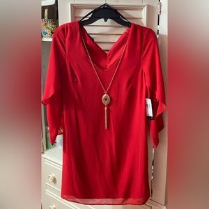 Red dress with gold necklace